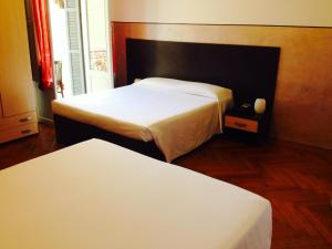 Postel nebo postele na pokoji v ubytování Hotel Liberty