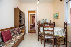 a living room with a couch and a table at Christina's House in Argostoli