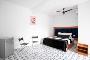 Llit o llits en una habitació de TM Calangute House Stay at Goa