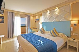 Säng eller sängar i ett rum på Hotel Tettola