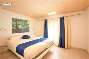 A bed or beds in a room at Appartamenti Green by Livigno Accomodation