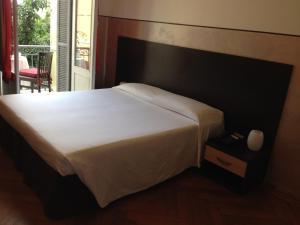 Postel nebo postele na pokoji v ubytování Hotel Liberty