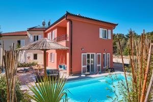 an image of a villa with a swimming pool at MEACres Sun in Miholašćica