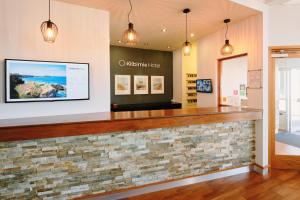 a lobby of a wellness center with a stone counter at The Kilbirnie Hotel in Newquay