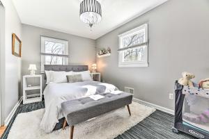 a bedroom with a bed and a tv at Pittsford Trolley Home - Near Erie Canal! in Pittsford