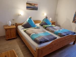Postel nebo postele na pokoji v ubytování Ferienhof-Stoertebeker