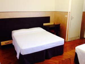 Postel nebo postele na pokoji v ubytování Hotel Liberty