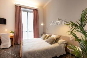 Voodi või voodid majutusasutuse Hotel Tigullio toas