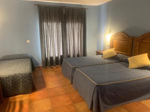 Katil atau katil-katil dalam bilik di Hotel Langa