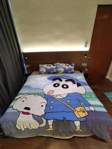 Llit o llits en una habitació de Crayon Shin-Chan Genting Highland @Geo38 Residence