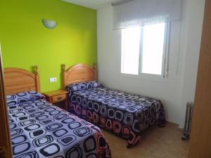 A bed or beds in a room at Los Juncos Még 13 kép