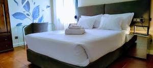 Postel nebo postele na pokoji v ubytování Hotel Ronda Valley