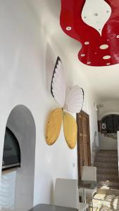a butterfly decoration on the wall of a room at Hostel Brikette in Positano