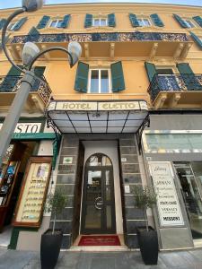 a hotel gibraltar with a street light in front of a building at Hotel Eletto in Sanremo