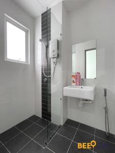 a bathroom with a shower and a sink at Mesa Hill Nilai by Beestay Management in Nilai