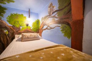 Posteľ alebo postele v izbe v ubytovaní Paradisio Baby & Kinder Hotel