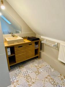 a bathroom with a sink and a mirror at La LocaLuna in Civray-de-Touraine