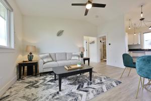 a living room with a couch and a table at Modern Upstairs Loft - Newly Renovated! in Salem