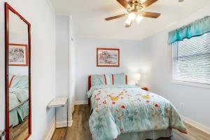 a bedroom with a bed and a ceiling fan at Drawbridge Rd 38 in Ocean Pines