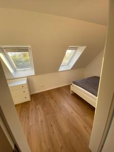 Llit o llits en una habitació de Ferienhaus Wesloer Landstraße 6a für 4 Personen