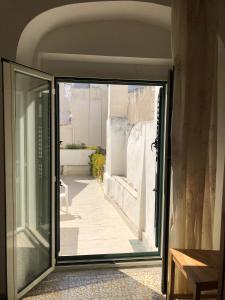 an open door with a view of a courtyard at Rocca Sul Mare Hotel in Vieste