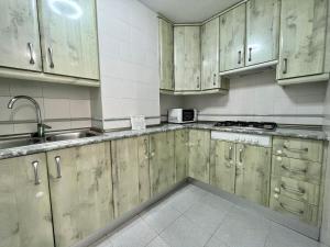Kuchyň nebo kuchyňský kout v ubytování Apartamento Playa Velilla Park II