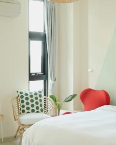 En eller flere senger på et rom på 宜蘭-讀好民宿 Read Nice House B&B 電梯民宿