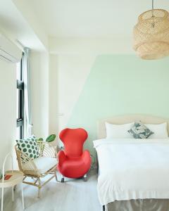 En eller flere senger på et rom på 宜蘭-讀好民宿 Read Nice House B&B 電梯民宿