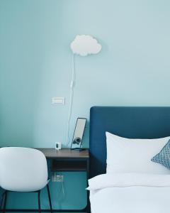 En eller flere senger på et rom på 宜蘭-讀好民宿 Read Nice House B&B 電梯民宿
