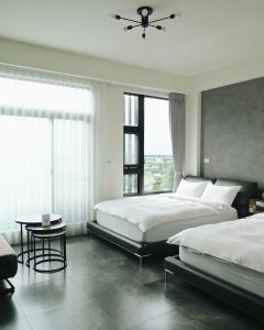 En eller flere senger på et rom på 宜蘭-讀好民宿 Read Nice House B&B 電梯民宿