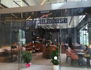 a restaurant with people sitting at tables in a building at Mercu Summer Suites KLCC by Star Residence in Kuala Lumpur