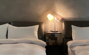 En eller flere senger på et rom på 宜蘭-讀好民宿 Read Nice House B&B 電梯民宿