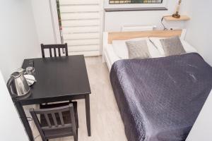 Uma cama ou camas num quarto em Zibi i Pod Topolami