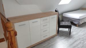 a bedroom with a desk and a bed and a chair at Ferienwohnung Bensdorf in Bensdorf