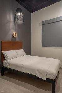 Ένα ή περισσότερα κρεβάτια σε δωμάτιο στο HM HOTEL EXPRESS