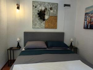 Postel nebo postele na pokoji v ubytování The Fig Garden by Lemo