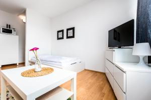 Televisor o centre d'entreteniment de Budget Apartment Köln