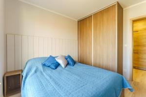 Posteľ alebo postele v izbe v ubytovaní APARTAMENT NA ARTYLERYJSKIEJ