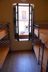 Postel nebo postele na pokoji v ubytování Albergue de peregrinos Compostela