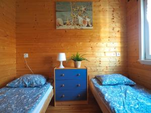 Postel nebo postele na pokoji v ubytování Słoneczny Zakątek Słajszewo