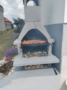 a outdoor oven with food inside of it at Villa Marijana in Varaždinske Toplice
