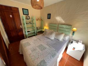 מיטה או מיטות בחדר ב-Posada de la Viuda