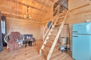 a wooden room with a wooden staircase in a house at Wood Village in Winiec