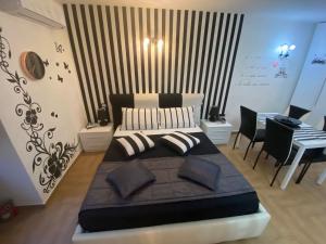 A bed or beds in a room at Residence Emozioni Ortigia