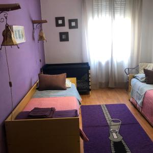 a bedroom with a bed and a dresser with a box at Apartment Parmense in Parma