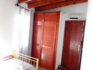 Łóżko lub łóżka w pokoju w obiekcie Casa Nazario Duplex