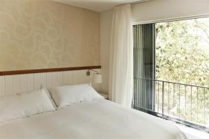 Postel nebo postele na pokoji v ubytování Hotel Casa Zapallar