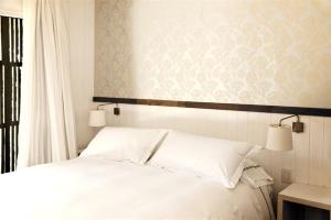 Postel nebo postele na pokoji v ubytování Hotel Casa Zapallar