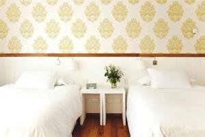 Postel nebo postele na pokoji v ubytování Hotel Casa Zapallar