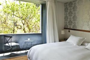 Postel nebo postele na pokoji v ubytování Hotel Casa Zapallar